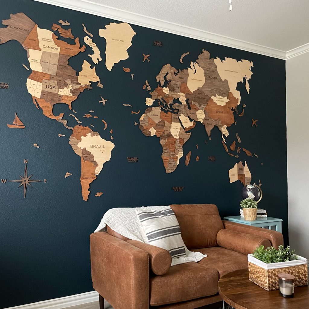 Wooden World Map Accent Wall on Blue Background